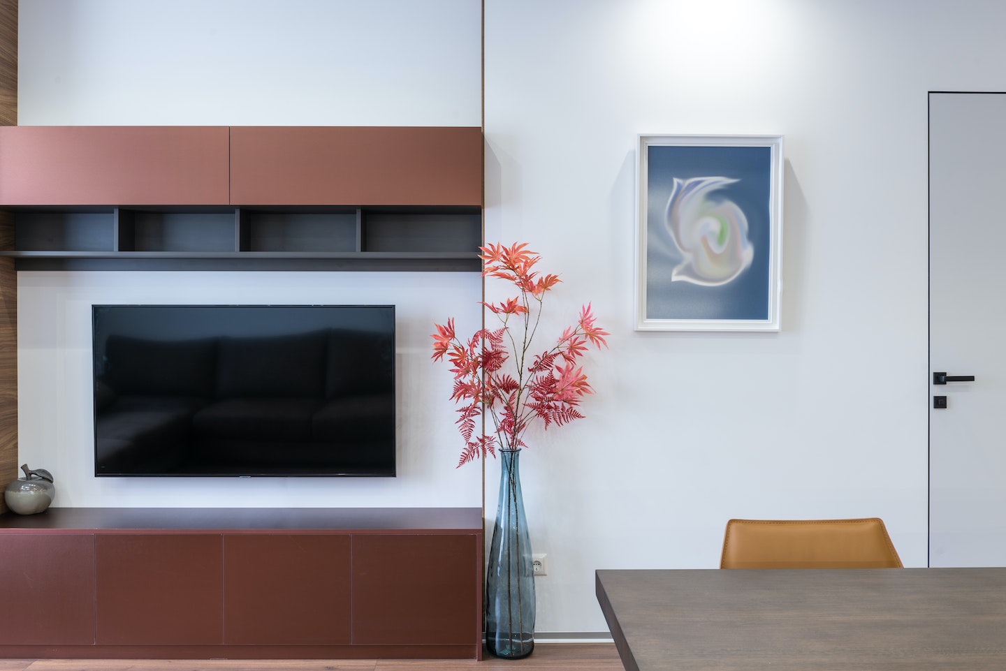 Image of a living room with a TV and picture frame