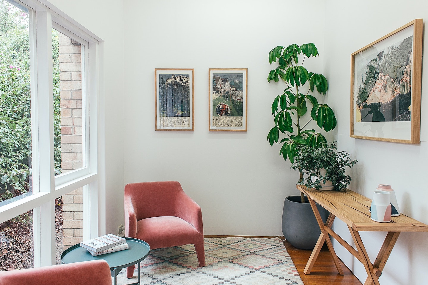 Image of an office space with picture frames around a window