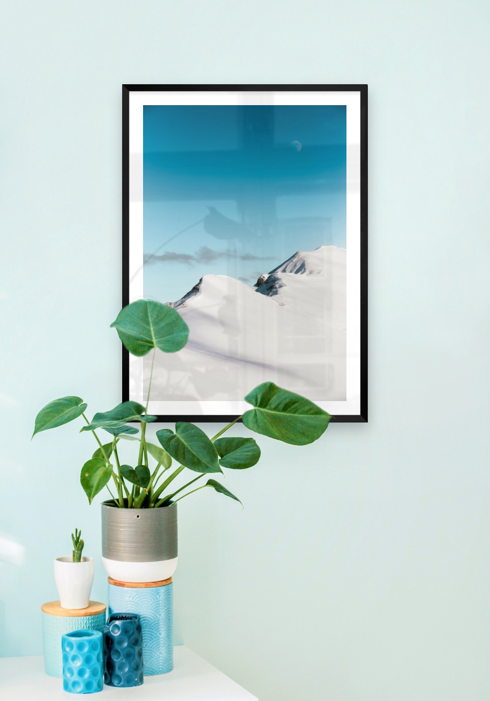Gallery wall with picture frame in black in size 50x70 with print "Snowy mountain peaks"
