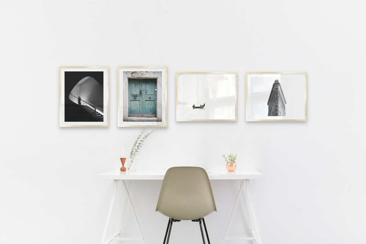 Gallery wall with picture frames in gold in sizes 40x50 with prints "Staircase", "Door", "People in boat" and "Triangular building"