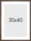 Frame in dark wood in the size 30x40cm