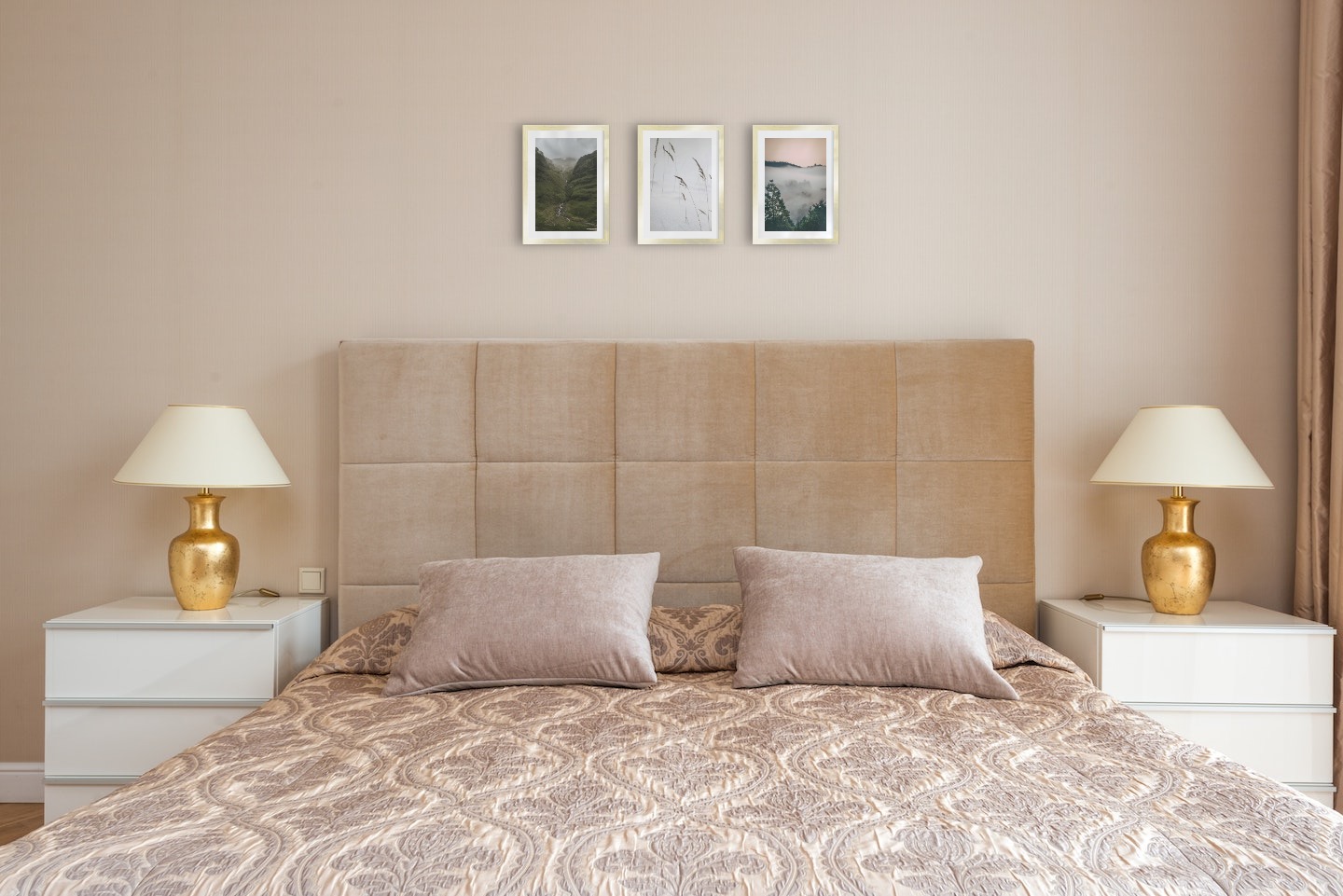 Gallery wall with picture frames in gold in sizes 21x30 with prints "Stream in valley", "Sharp in the snow" and "Wooden tops and orange sky"