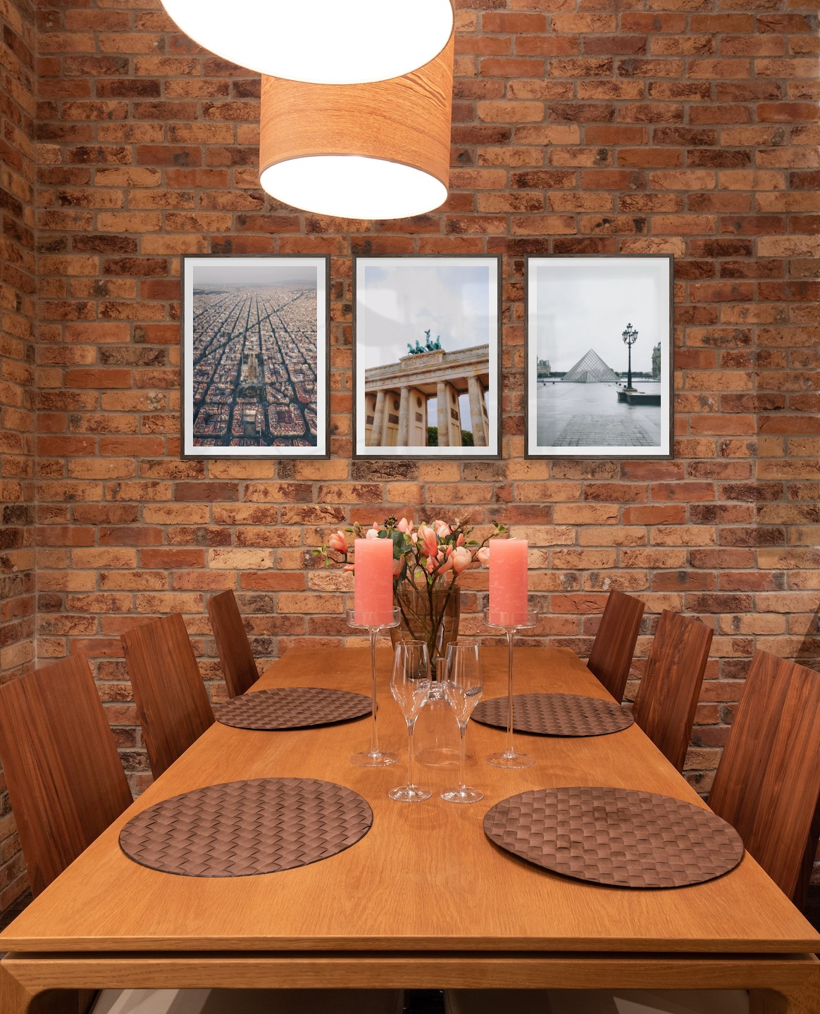 Gallery wall with picture frames in dark wood in sizes 50x70 with prints "Barcelona city center", "Berlin" and "Louvre in Paris"