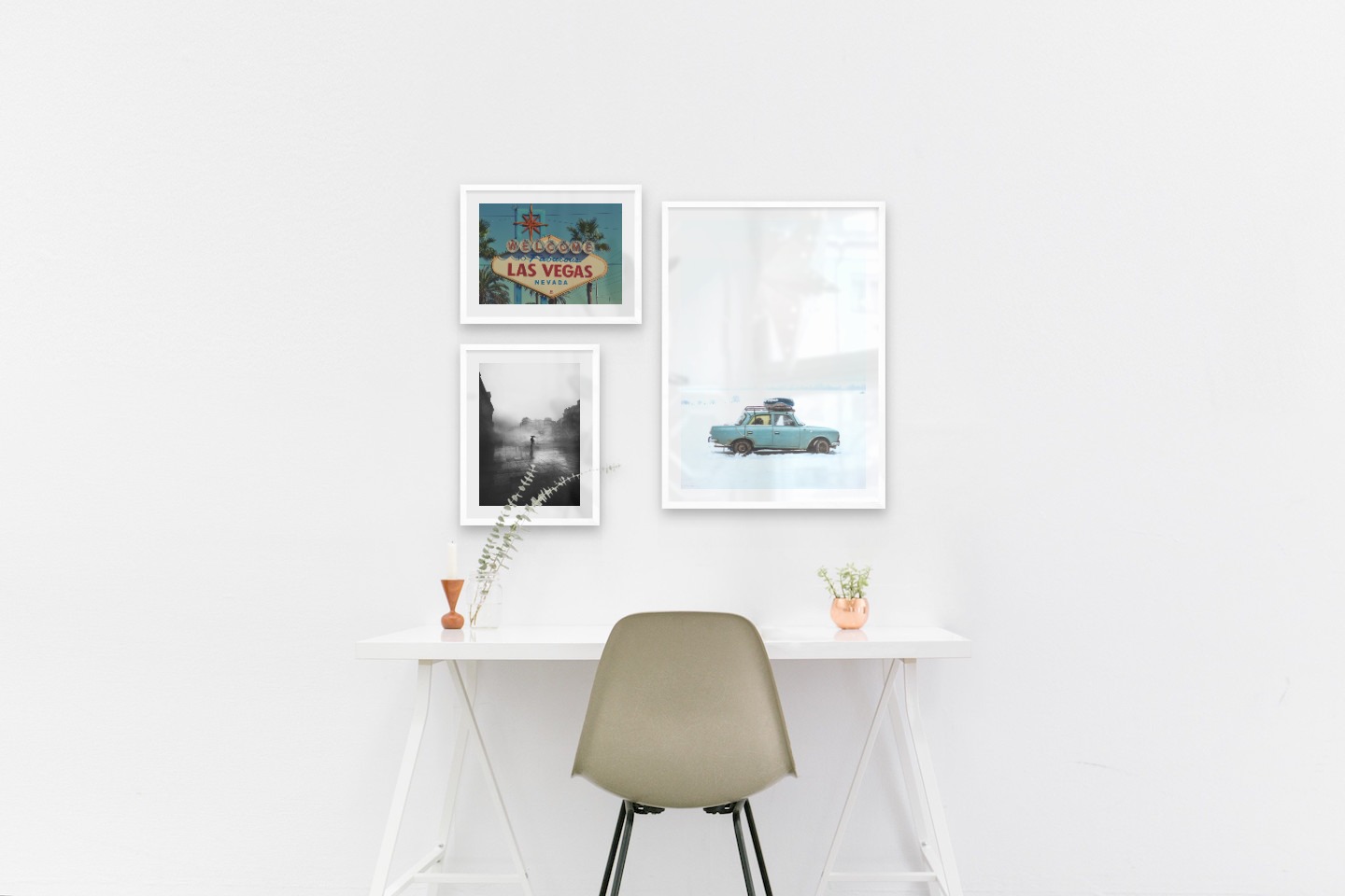 Gallery wall with picture frames in white in sizes 30x40 and 50x70 with prints "Las Vegas sign", "Rainy city" and "Car in snow"
