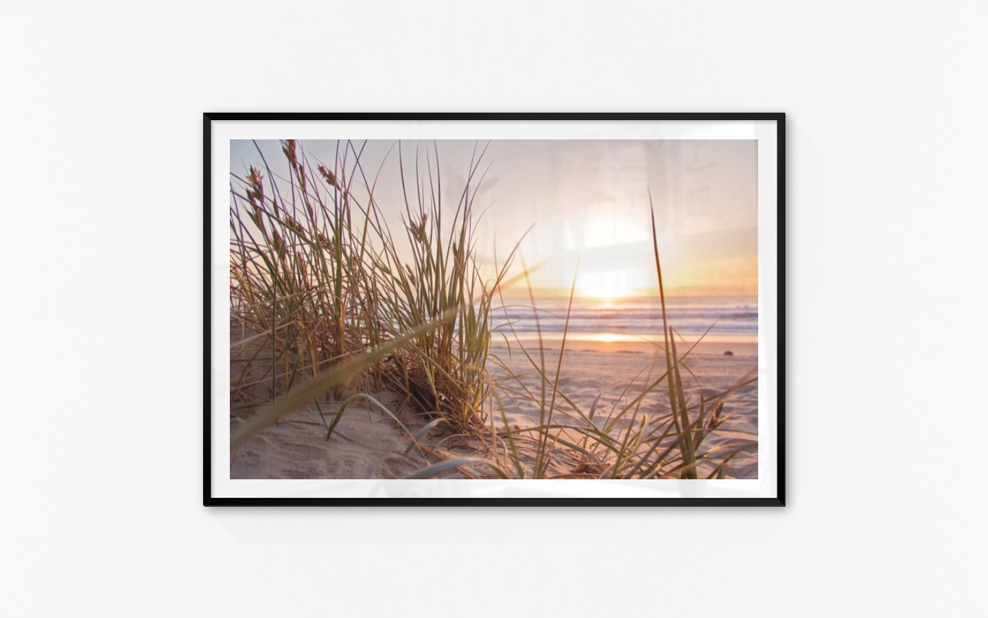Gallery wall with picture frame in black in size 100x150 with print "Straw on the beach"