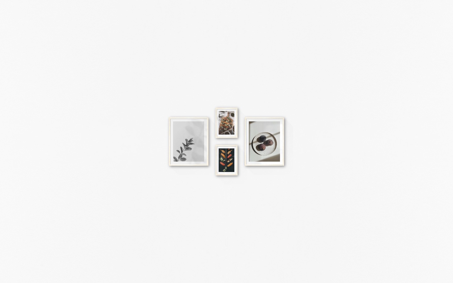 Gallery wall with picture frames in light wood in sizes 40x50 and 21x30 with prints "Twig", "Sushi", "Dumplings" and "Fruit on plate"