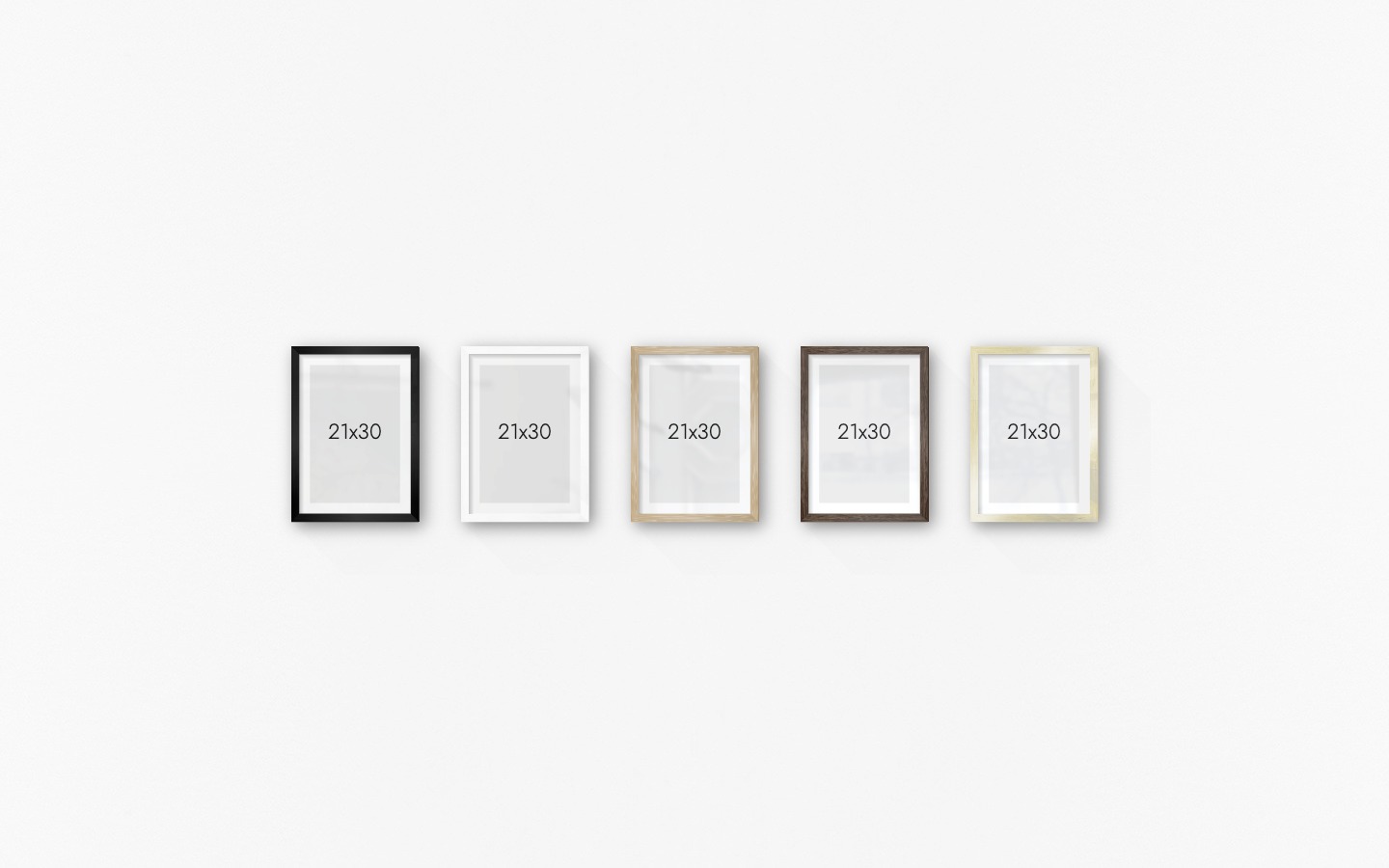 Gallery wall with picture frames in black, white, wood, dark wood and gold in sizes 21x30