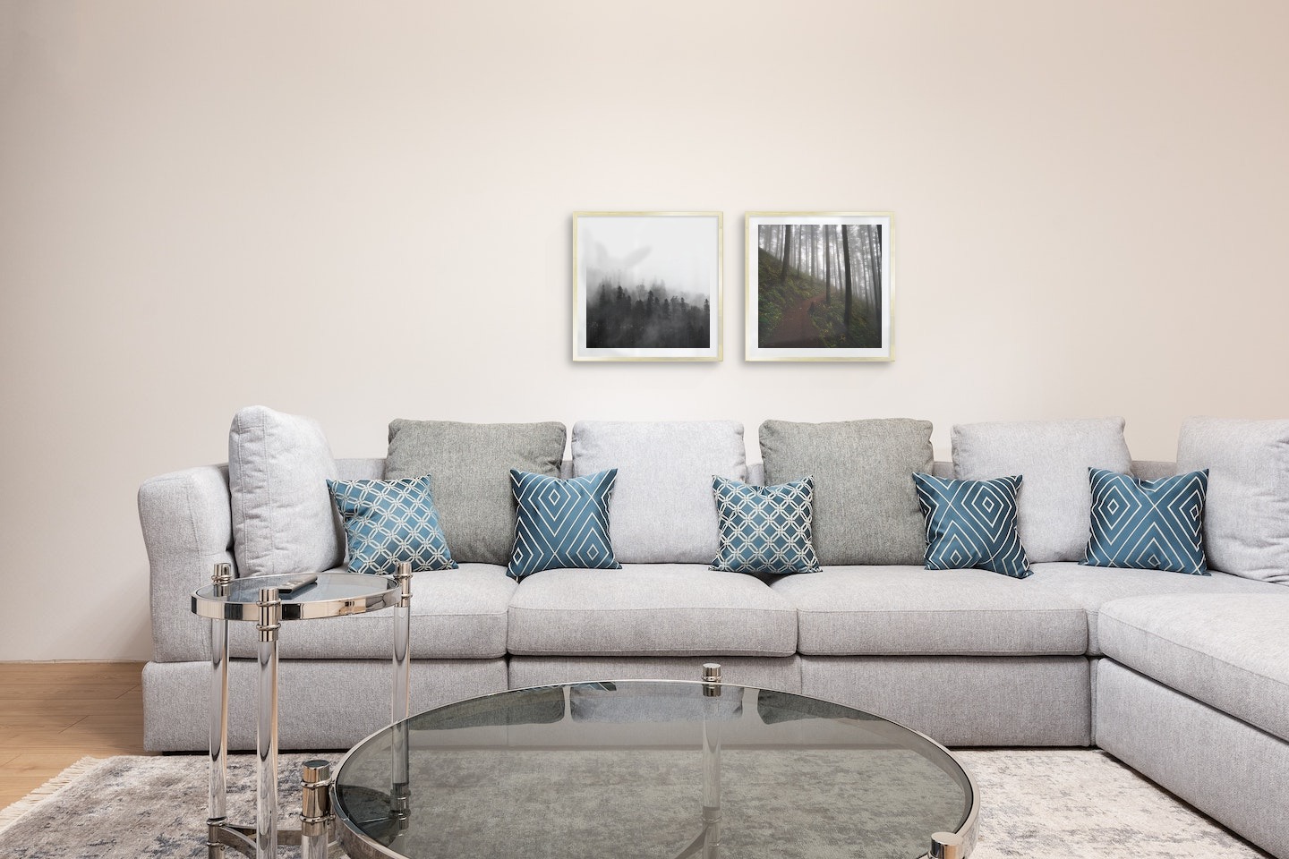 Gallery wall with picture frames in gold in sizes 50x50 with prints "Foggy wooden tops" and "Forest road"