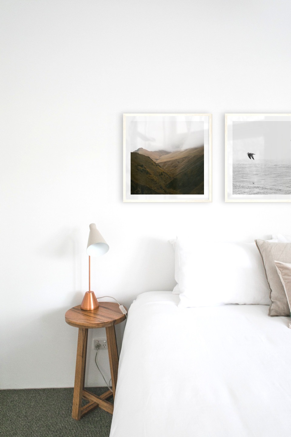 Gallery wall with picture frames in light wood in sizes 50x50 with prints "Foggy valley" and "Birds over the sea"
