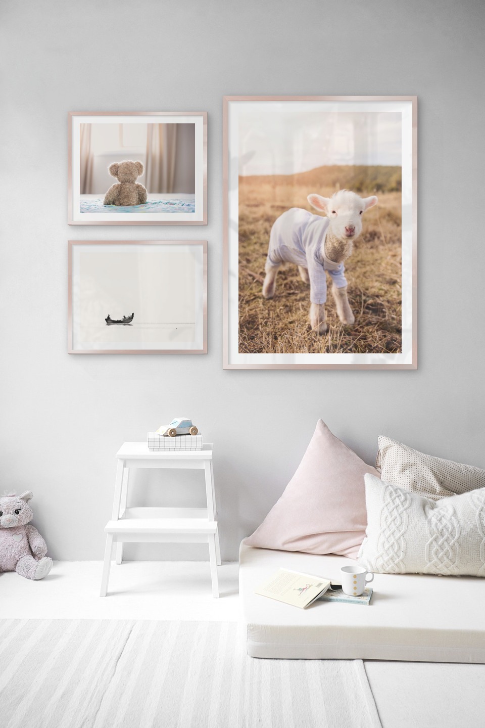 Gallery wall with picture frames in copper in sizes 40x50 and 70x100 with prints "Teddy bear in front of window", "People in boat" and "Lamb"