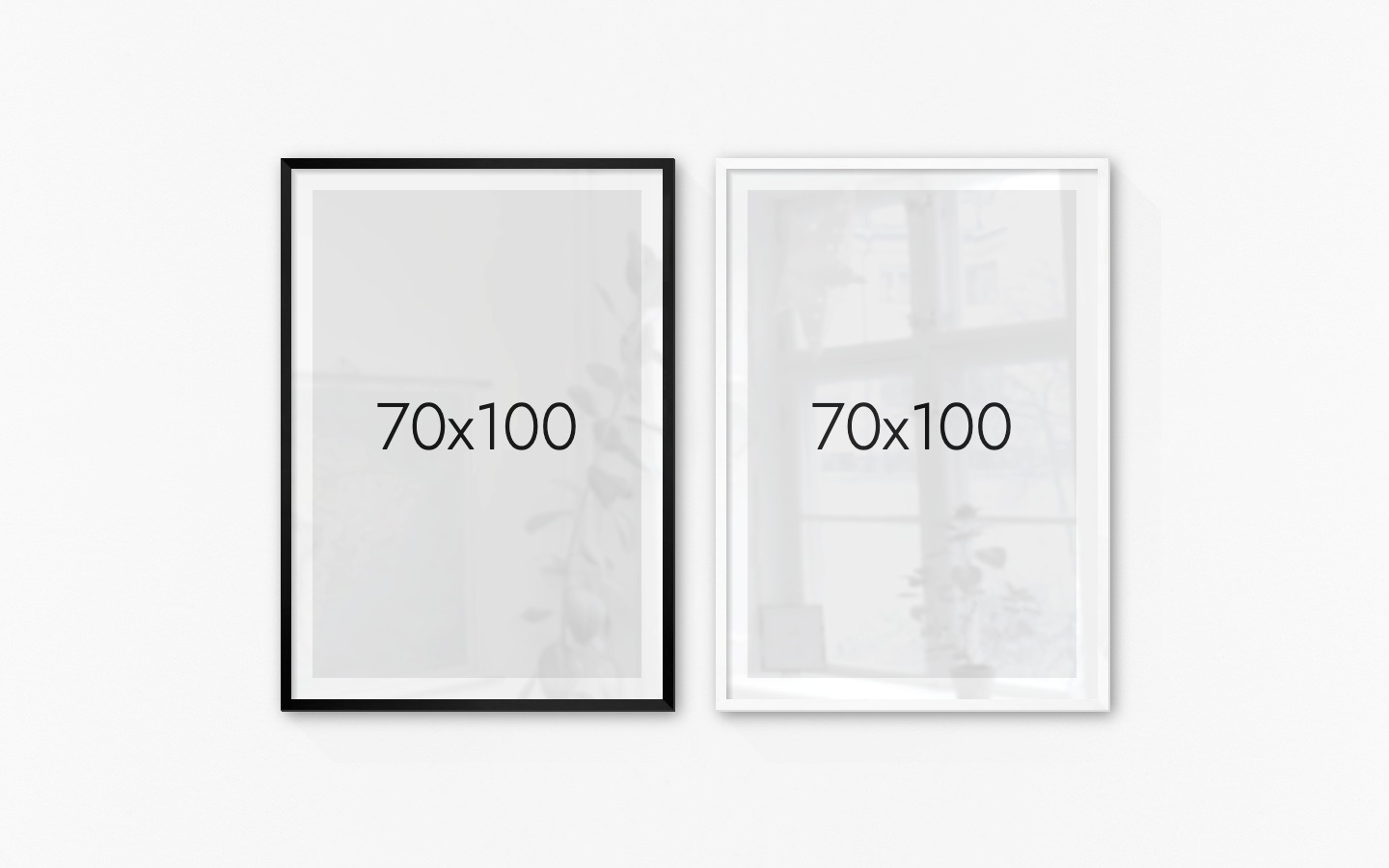 Gallery wall with picture frames in black and white in sizes 70x100