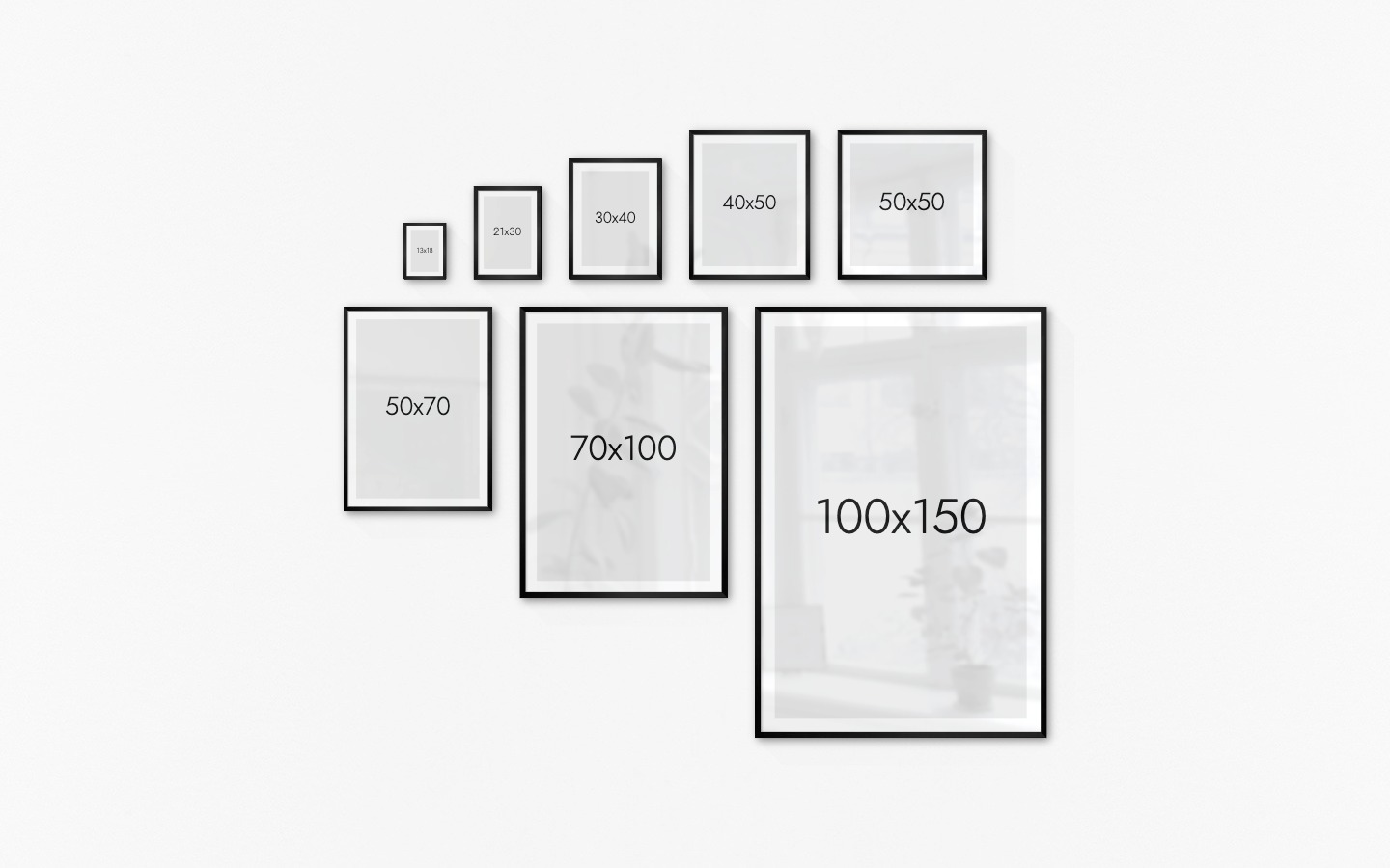Gallery wall with picture frames in black in sizes 13x18, 21x30, 30x40, 40x50, 50x50, 50x70, 70x100 and 100x150