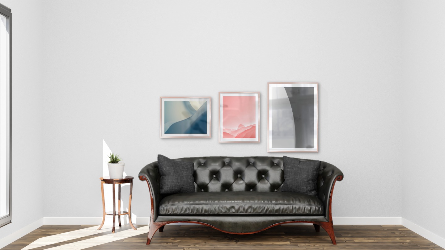 Gallery wall with picture frames in copper in sizes 40x50 and 50x70 with prints "Blue geometry", "Pink sky" and "Line"