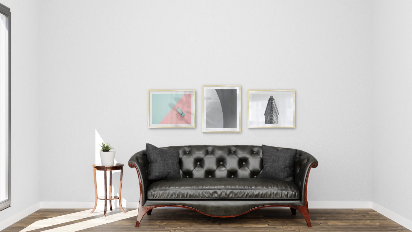 Gallery wall with picture frames in gold in sizes 40x50 with prints "Blue car and pink", "Line" and "Triangular building"