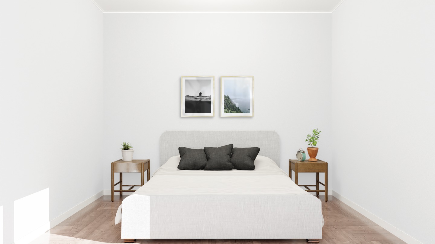 Gallery wall with picture frames in gold in sizes 40x50 with prints "Person in the water" and "Rocks facing the water"