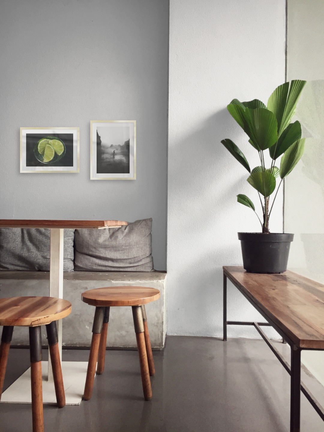 Gallery wall with picture frames in gold in sizes 30x40 with prints "Lime and glass" and "Rainy city"