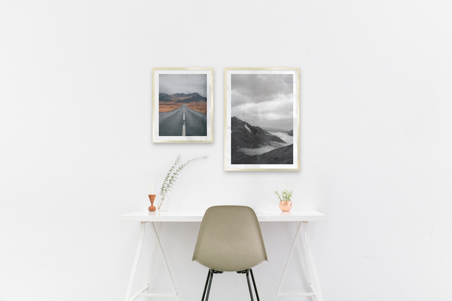 Gallery wall with picture frames in gold in sizes 40x50 and 50x70 with prints "Road and mountains" and "Road among mountains"