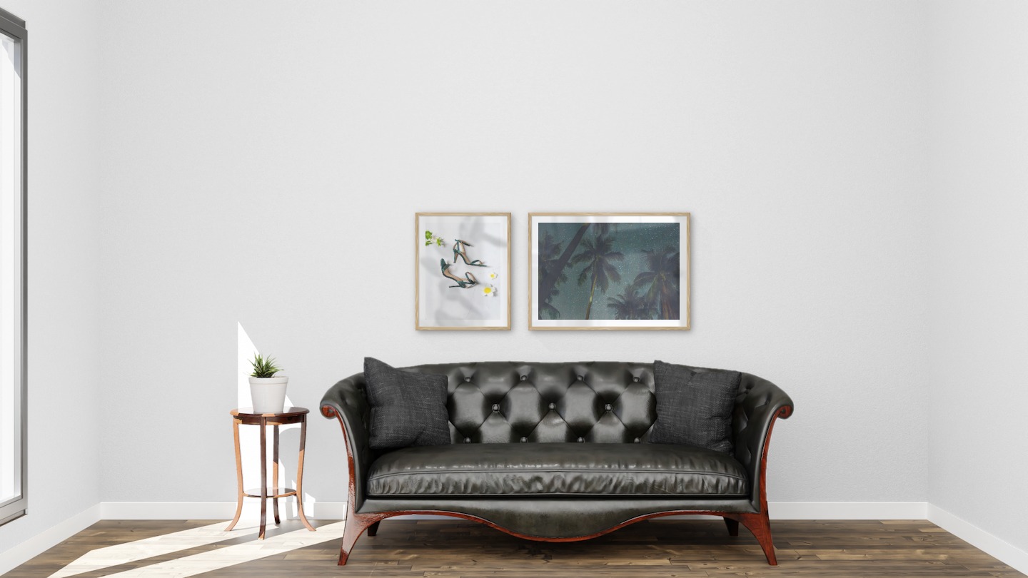 Gallery wall with picture frames in wood in sizes 40x50 and 50x70 with prints "Heels" and "Palm trees and night sky"