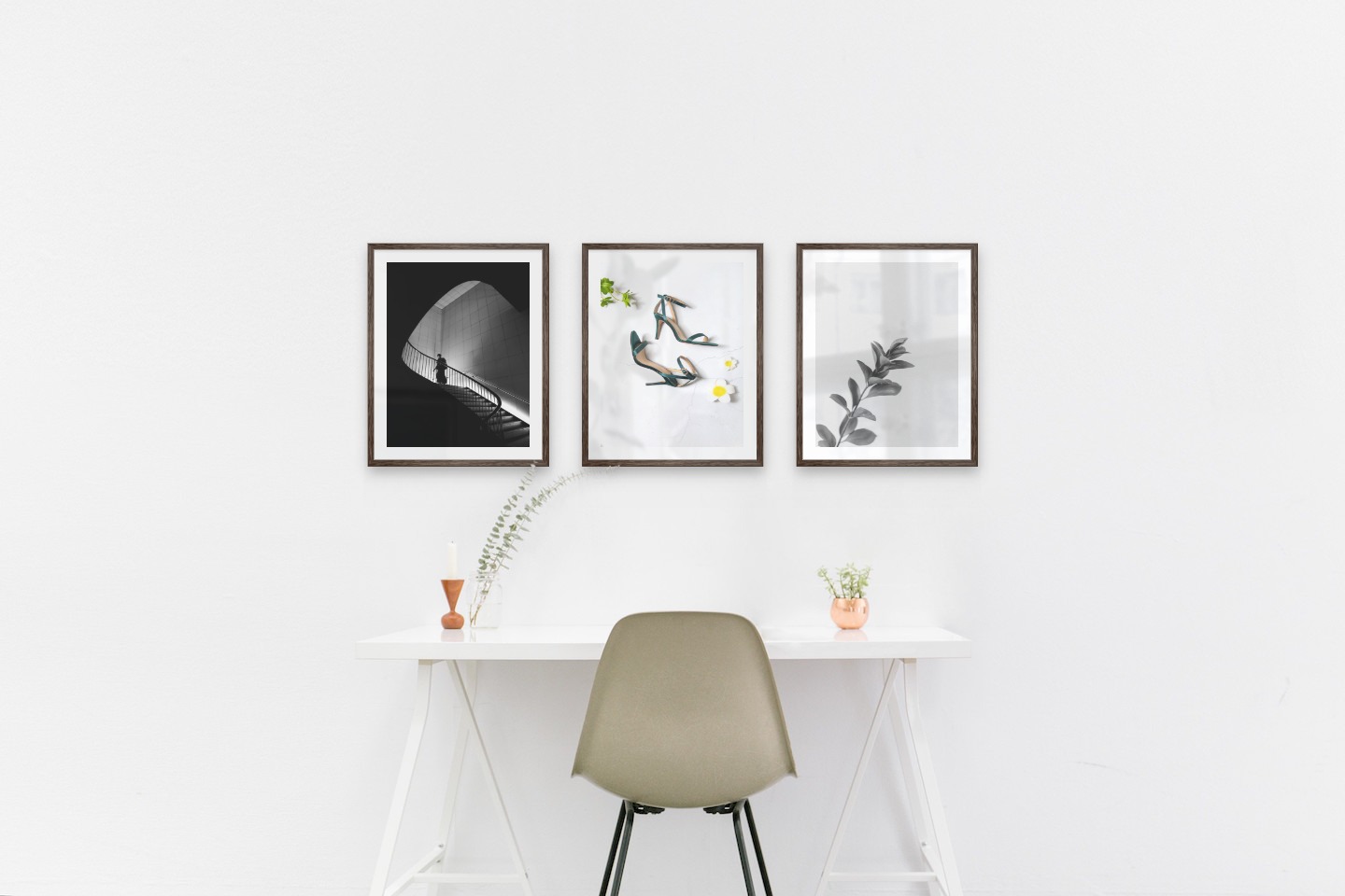 Gallery wall with picture frames in dark wood in sizes 40x50 with prints "Staircase", "Heels" and "Twig"