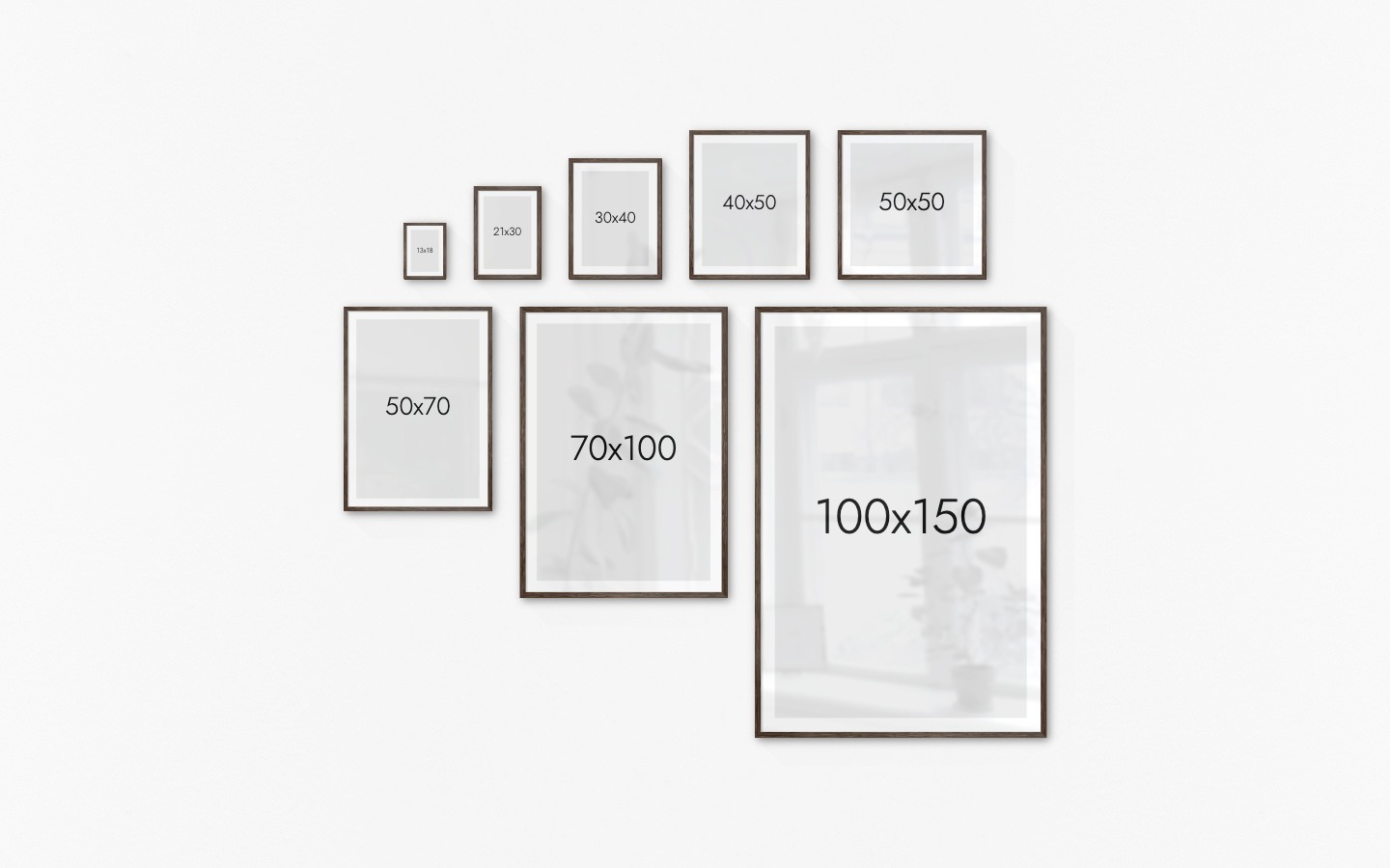Gallery wall with picture frames in dark wood in sizes 13x18, 21x30, 30x40, 40x50, 50x50, 50x70, 70x100 and 100x150