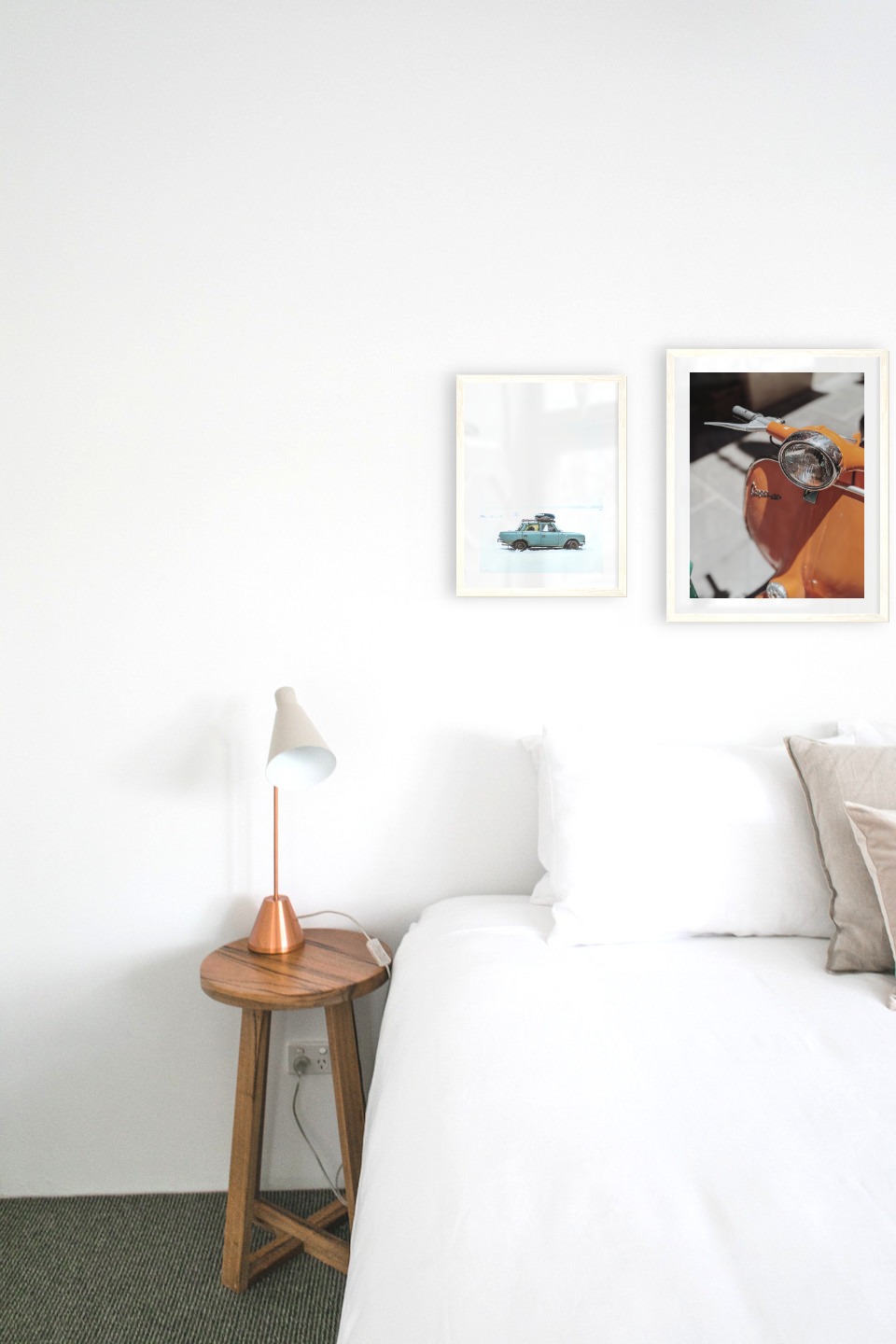 Gallery wall with picture frames in light wood in sizes 30x40 and 40x50 with prints "Car in snow" and "Orange vespa"