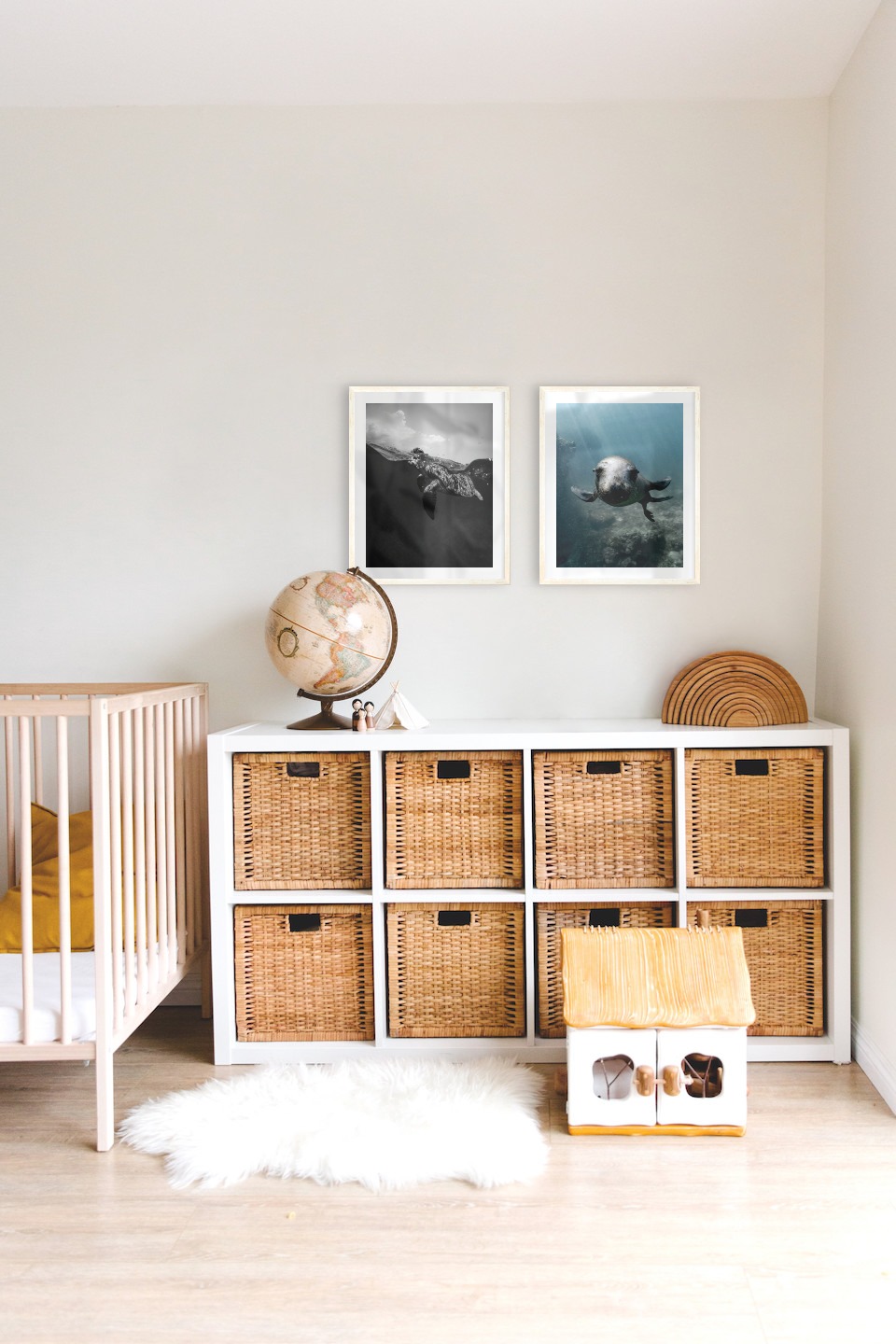 Gallery wall with picture frames in light wood in sizes 40x50 with prints "Turtle" and "Seal in the water"