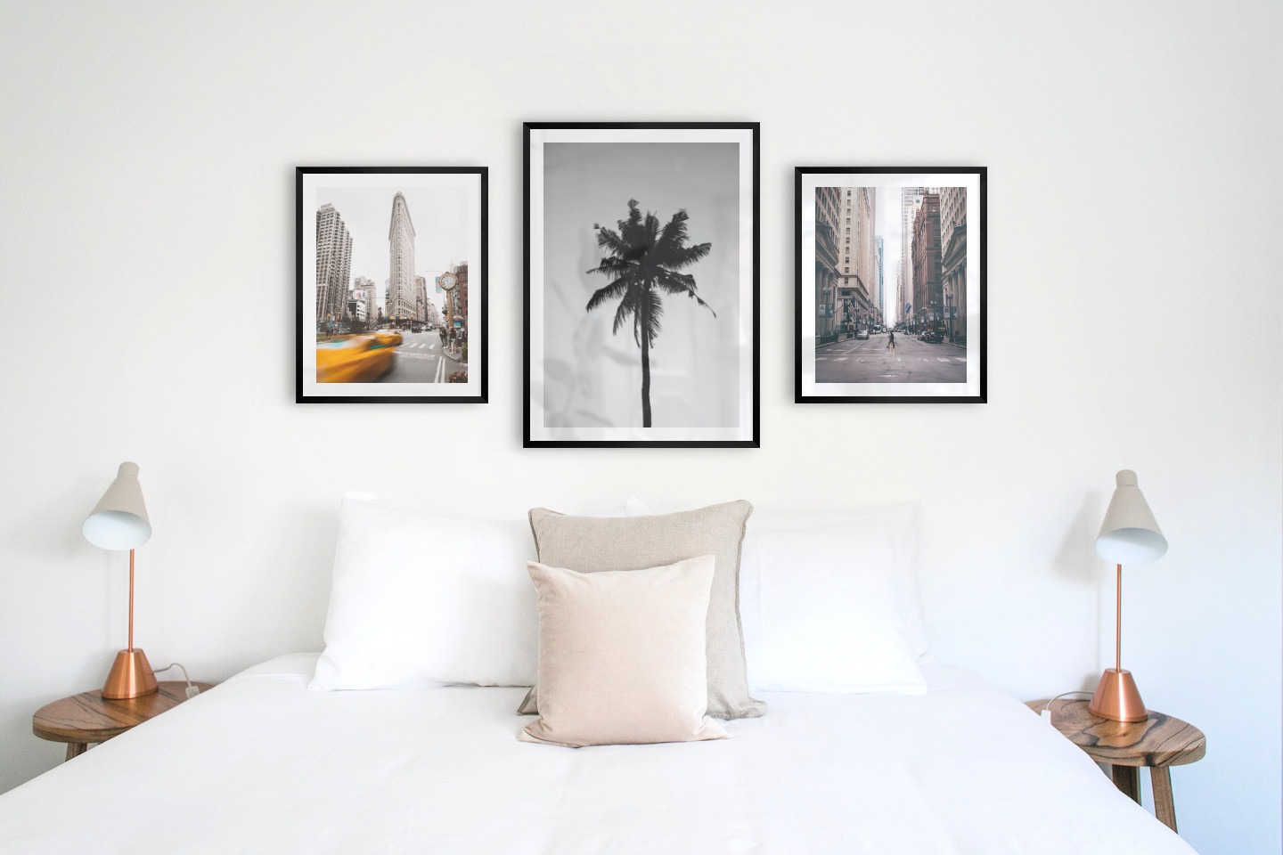 Gallery wall with picture frames in black in sizes 40x50 and 50x70 with prints "Yellow taxis in town", "Palm" and "Man walking across the street"