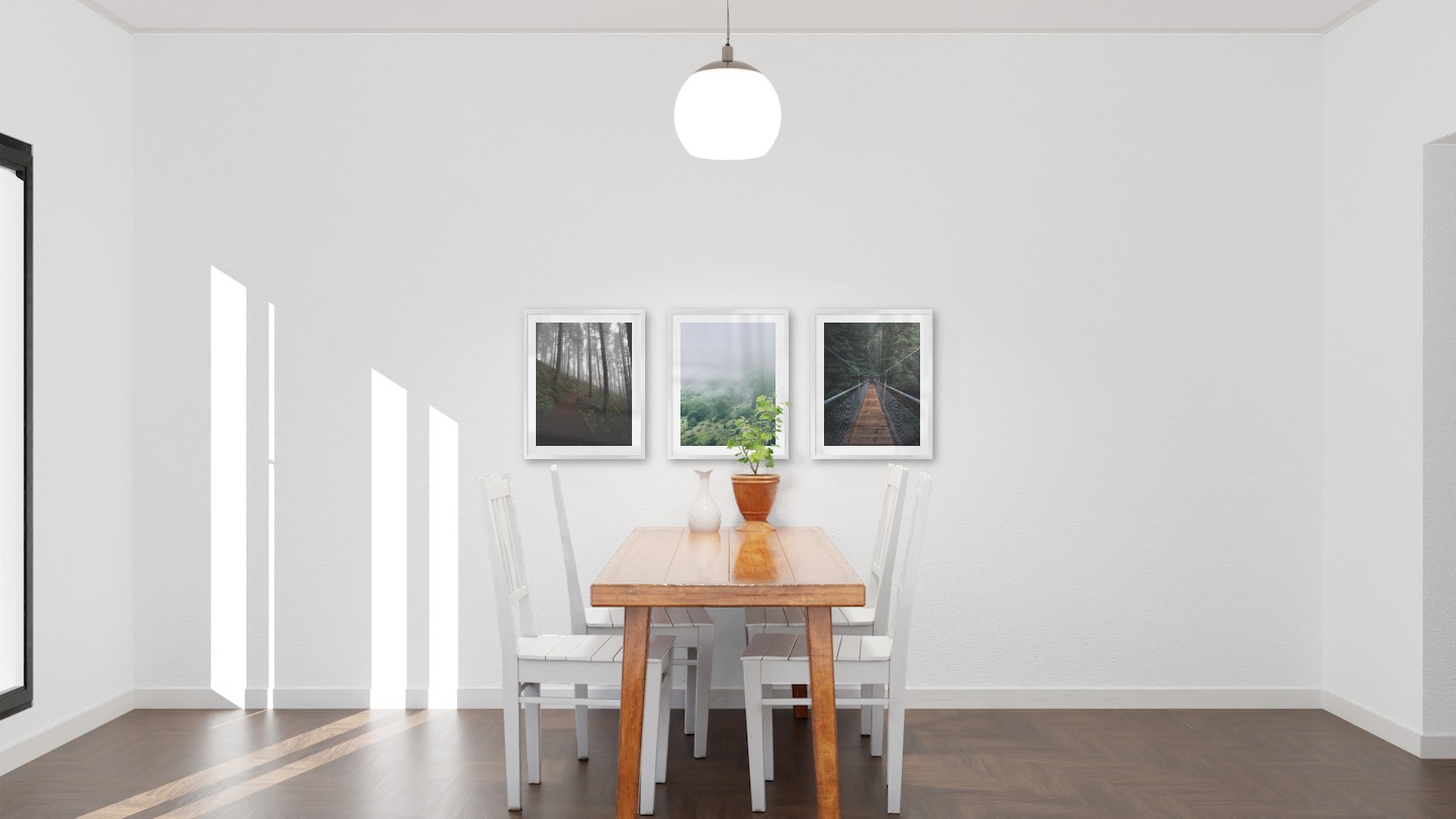 Gallery wall with picture frames in silver in sizes 40x50 with prints "Forest road", "Slope with trees" and "Bridge in the woods"
