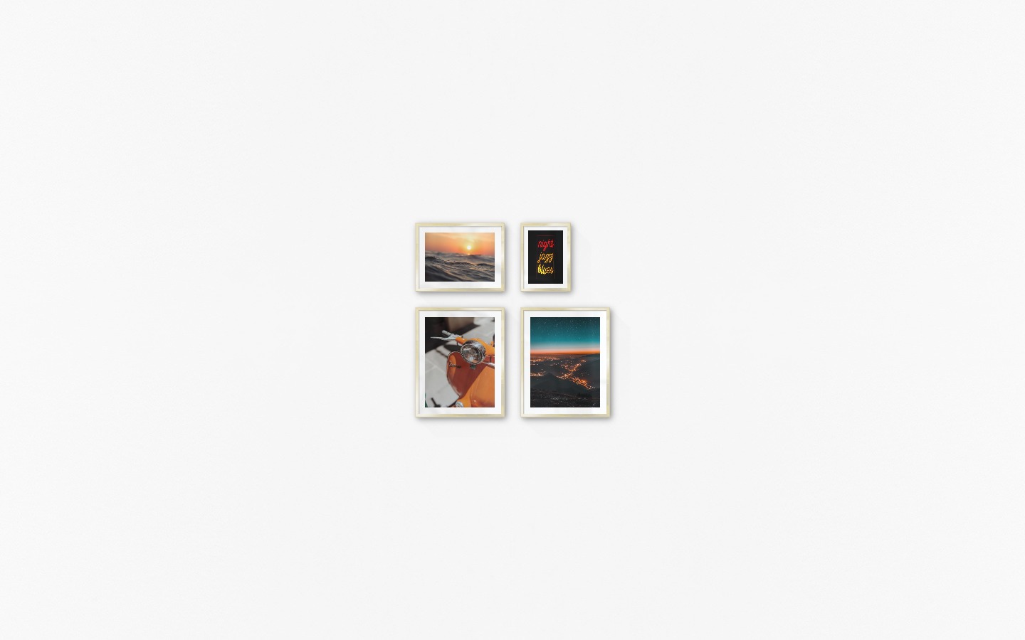 Gallery wall with picture frames in gold in sizes 40x50, 30x40 and 21x30 with prints "Orange vespa", "City lights on mountains", "Waves and the sun" and "Neon signs"