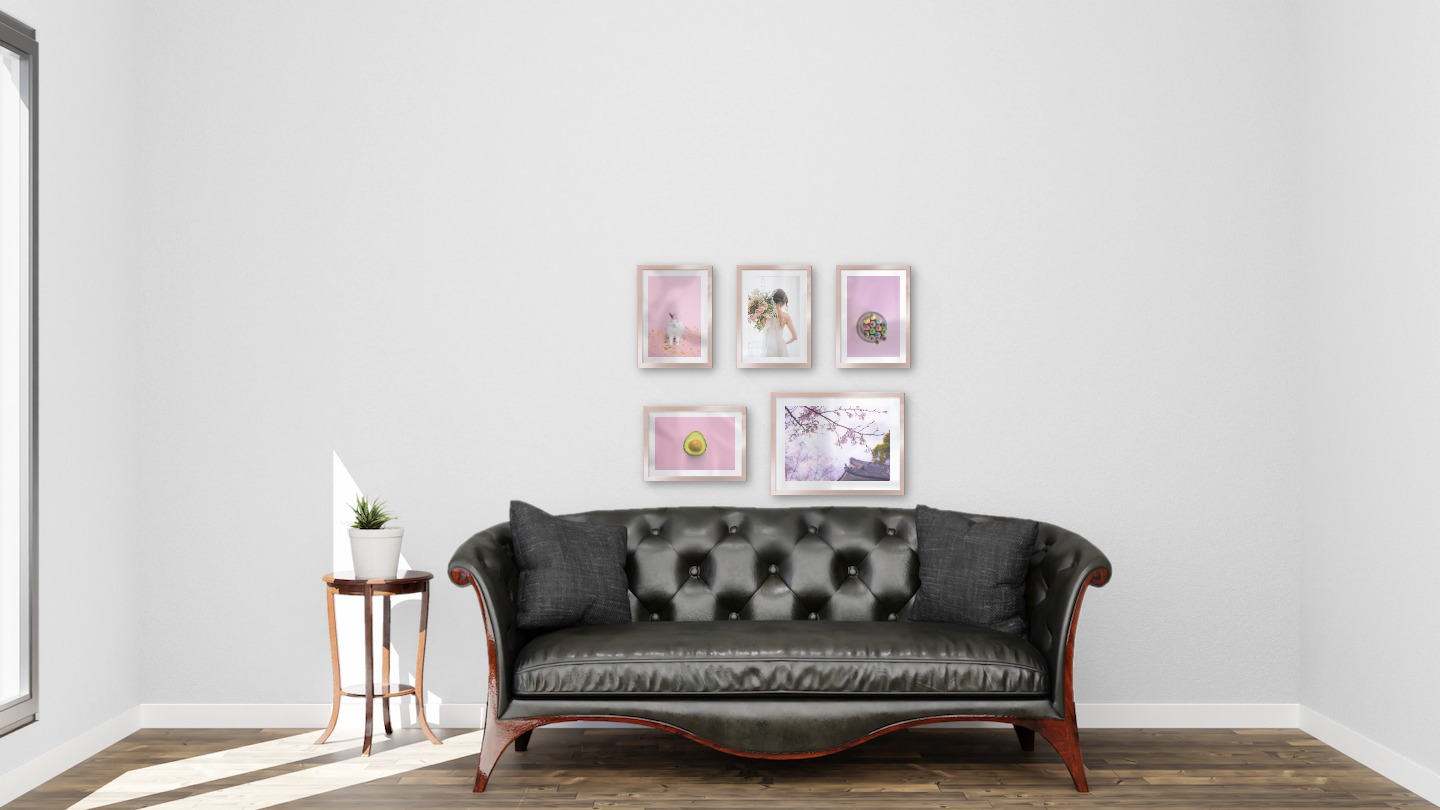 Gallery wall with picture frames in copper in sizes 21x30 and 30x40 with prints "Rabbit with party hat", "Bride and flowers", "Canned pens", "Avocado" and "Flowers in Tokyo"