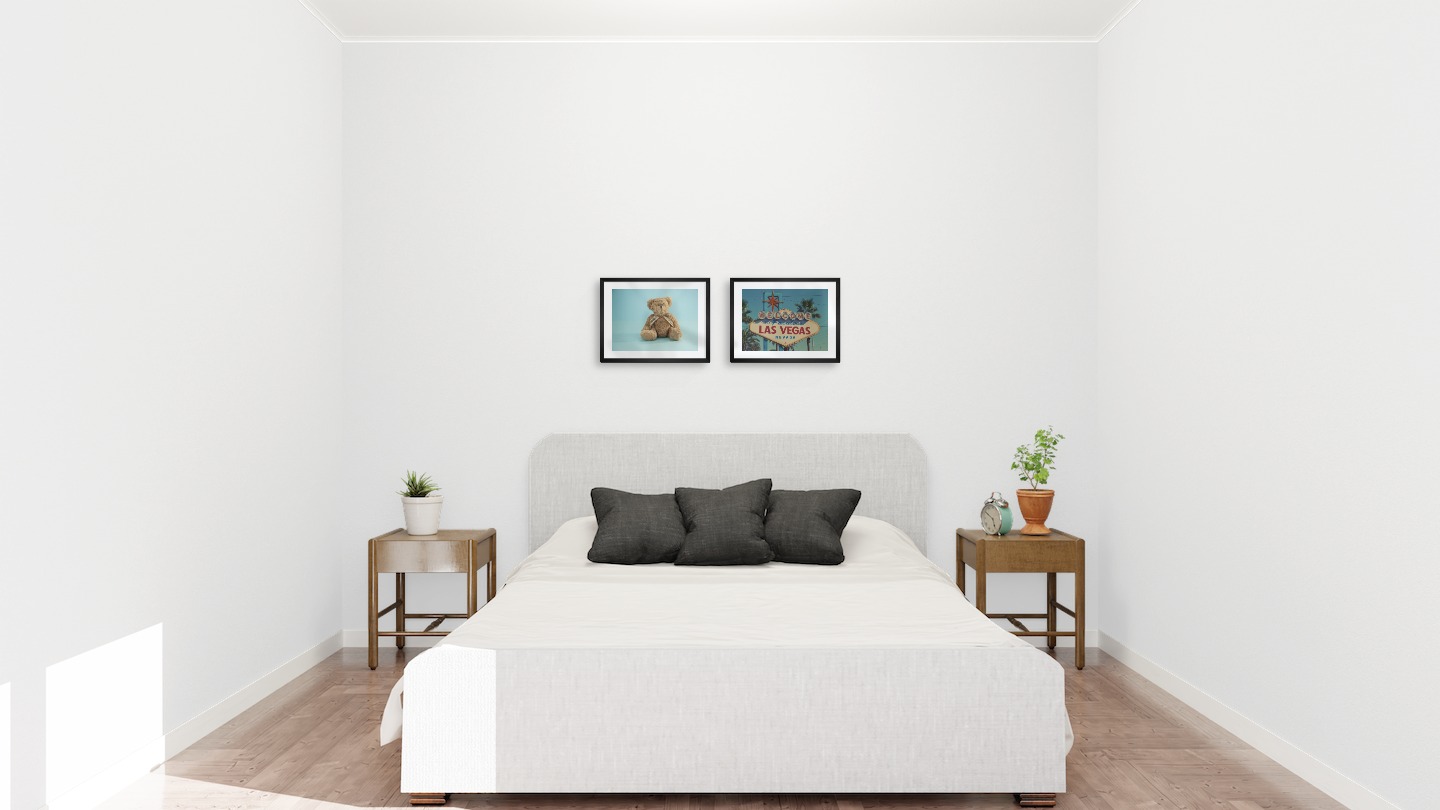 Gallery wall with picture frames in black in sizes 30x40 with prints "Teddy bear and blue" and "Las Vegas sign"