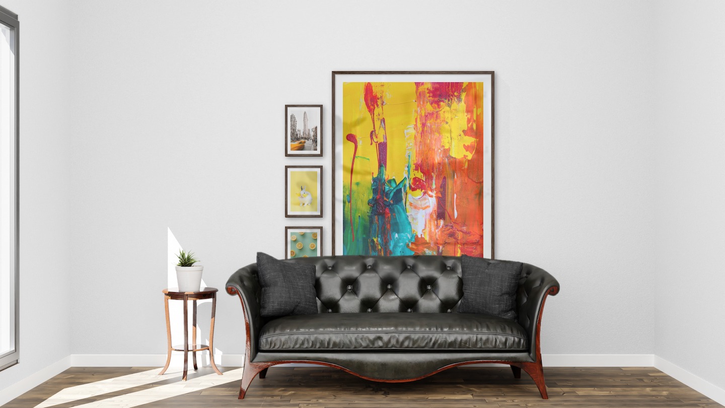 Gallery wall with picture frames in dark wood in sizes 21x30 and 100x150 with prints "Yellow taxis in town", "Rabbit with glasses", "Lemons" and "Abstract art 5"