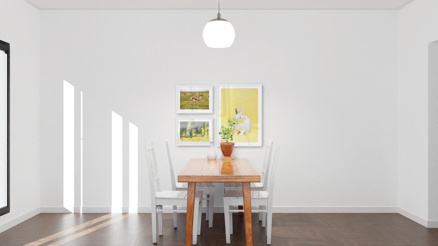 Gallery wall with picture frames in white in sizes 30x40 and 50x70 with prints "Antelopes in meadow", "Hummingbirds" and "Rabbit with glasses"