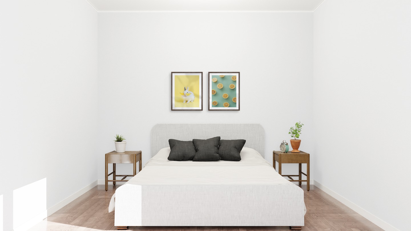 Gallery wall with picture frames in dark wood in sizes 40x50 with prints "Rabbit with glasses" and "Lemons"