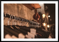 Gallery wall with picture frame in black in size 50x70 with print "Clothes hangers"