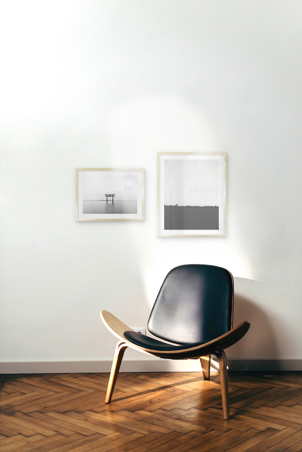 Gallery wall with picture frames in gold in sizes 30x40 and 40x50 with prints "Pillars in the water" and "Sky above trees"