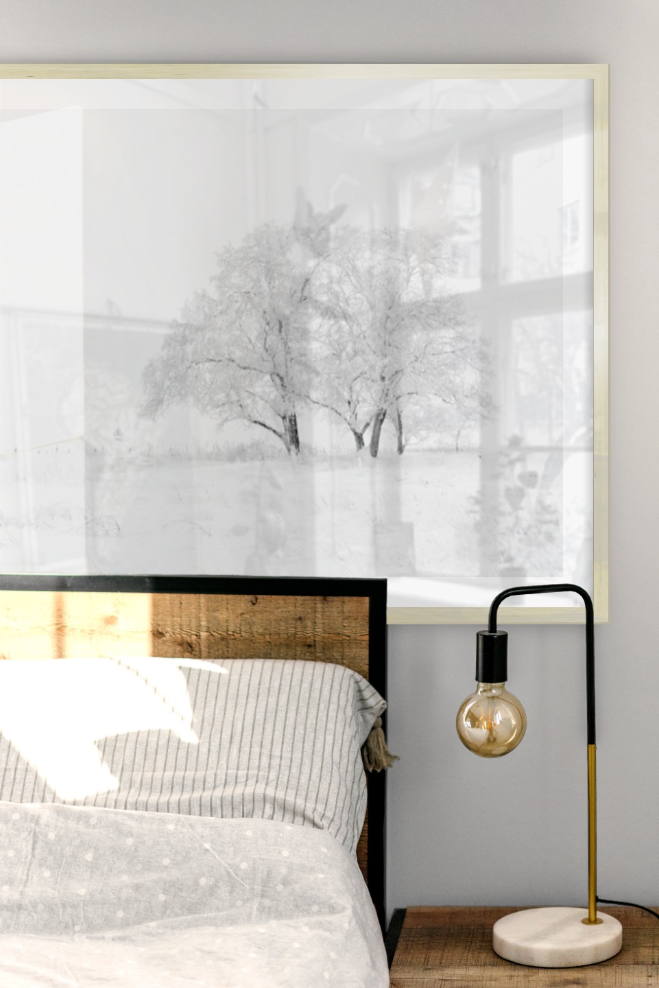 Gallery wall with picture frame in gold in size 70x100 with print "Snowy tree"