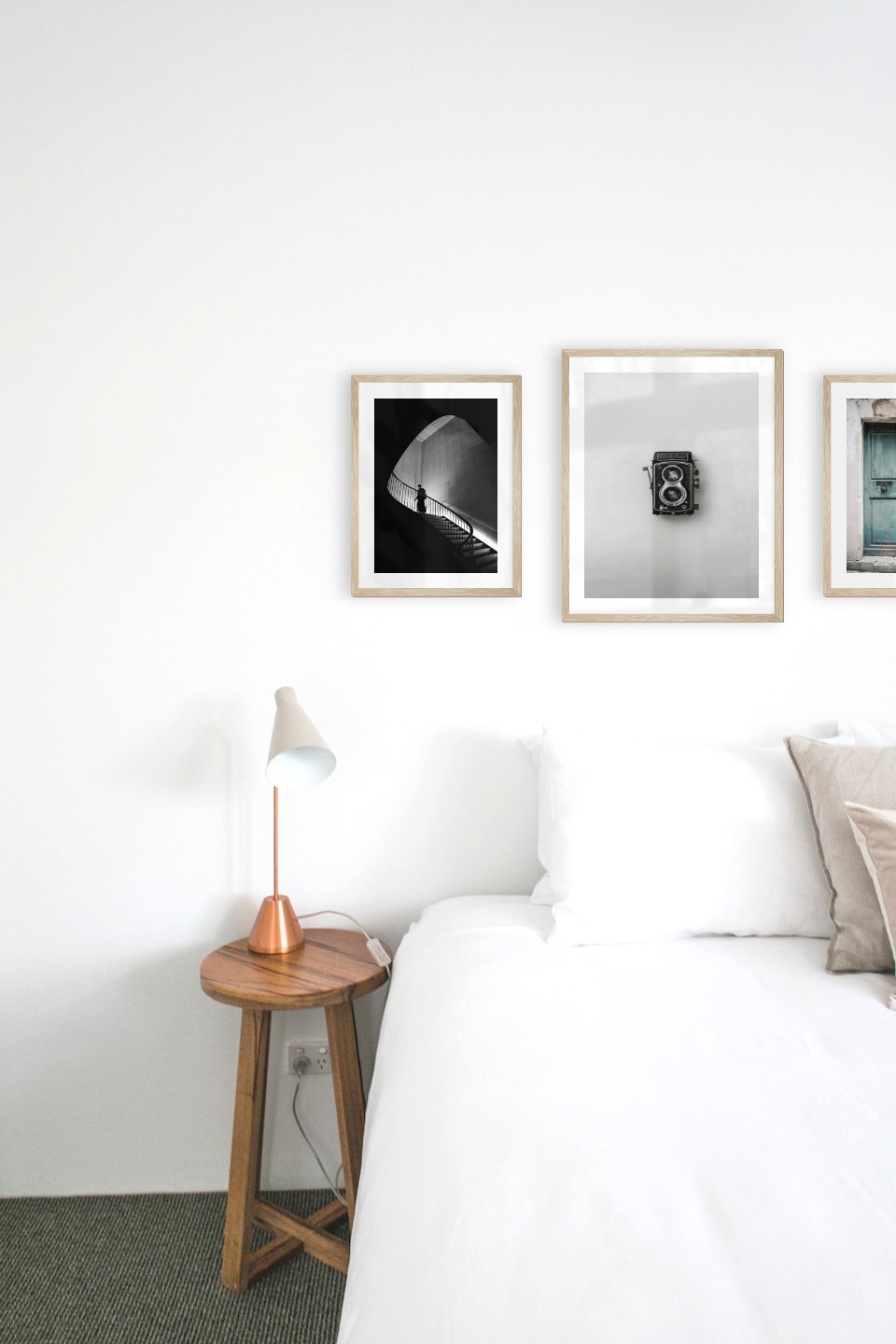 Gallery wall with picture frames in wood in sizes 30x40 and 40x50 with prints "Staircase", "Camera" and "Door"