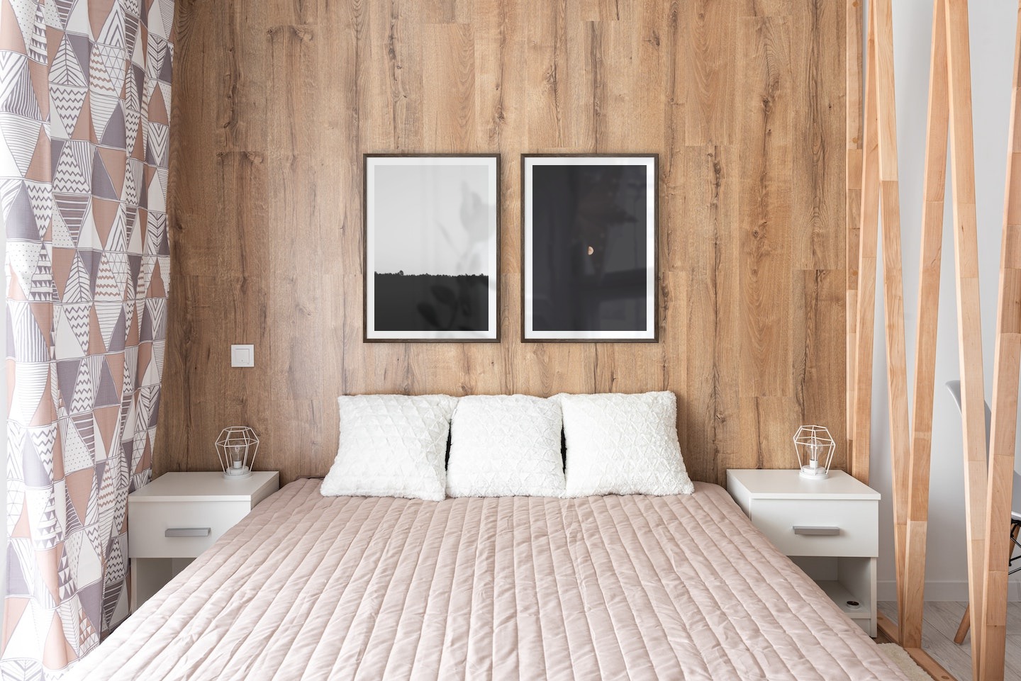 Gallery wall with picture frames in dark wood in sizes 50x70 with prints "Sky above trees" and "The moon"