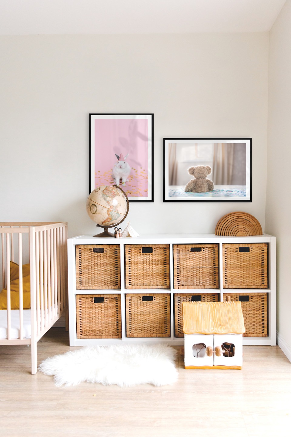 Gallery wall with picture frames in black in sizes 50x70 with prints "Rabbit with party hat" and "Teddy bear in front of window"
