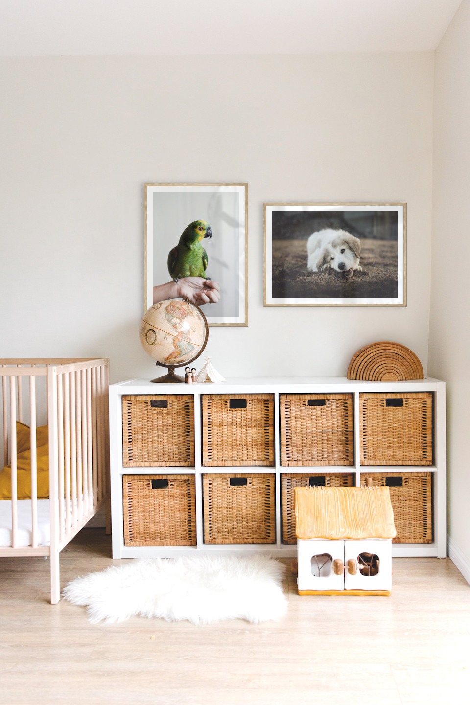 Gallery wall with picture frames in wood in sizes 50x70 with prints "Green parrot" and "Dog chewing"