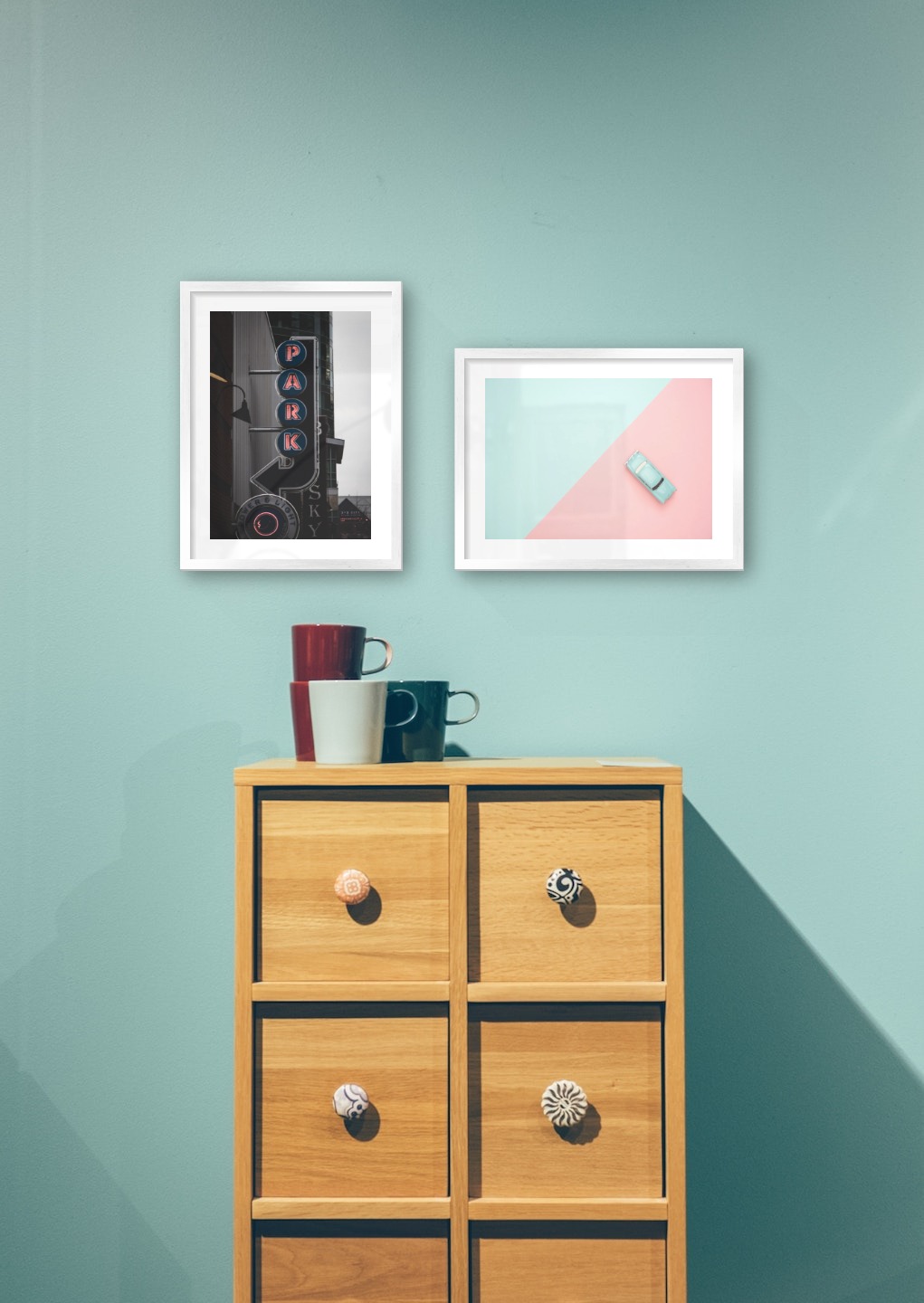 Gallery wall with picture frames in silver in sizes 30x40 with prints "Sign "Park"" and "Blue car and pink"