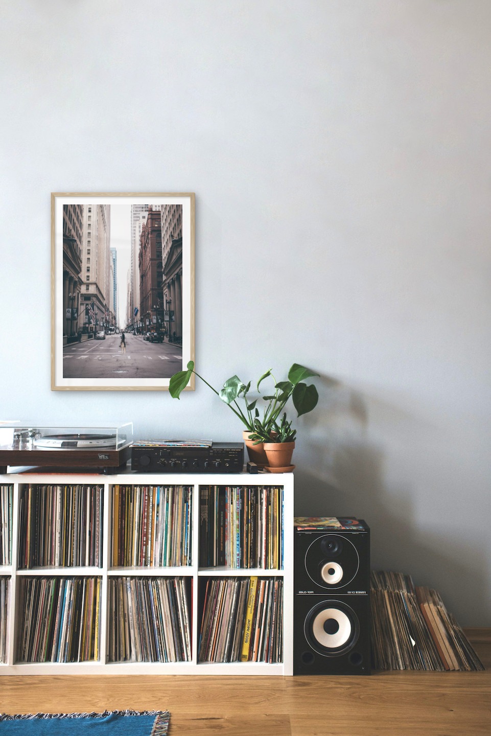 Gallery wall with picture frame in wood in size 50x70 with print "Man walking across the street"