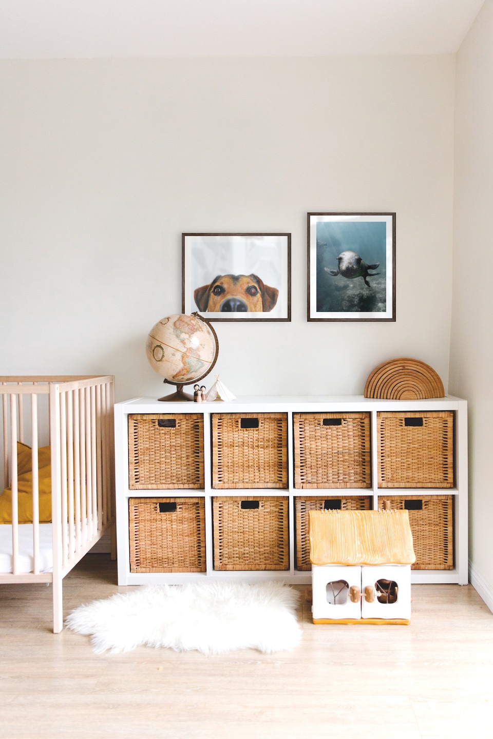 Gallery wall with picture frames in dark wood in sizes 40x50 with prints "Hundnos" and "Seal in the water"