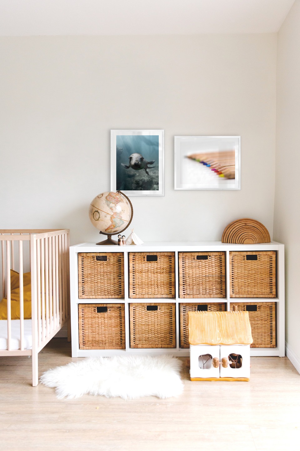 Gallery wall with picture frames in silver in sizes 40x50 with prints "Seal in the water" and "Pencils in different colors"