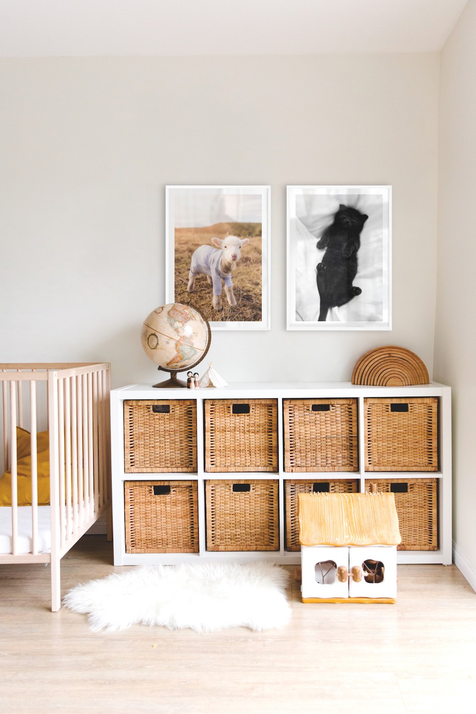 Gallery wall with picture frames in white in sizes 50x70 with prints "Lamb" and "Cat in bed"
