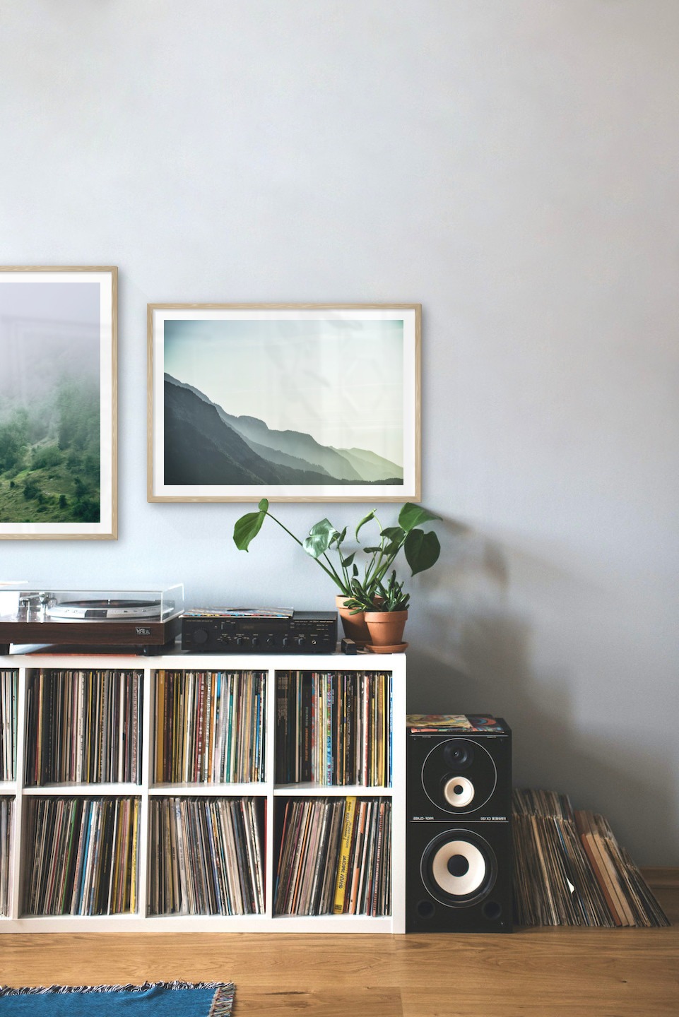 Gallery wall with picture frames in wood in sizes 50x70 with prints "Slope with trees" and "Foggy mountain"