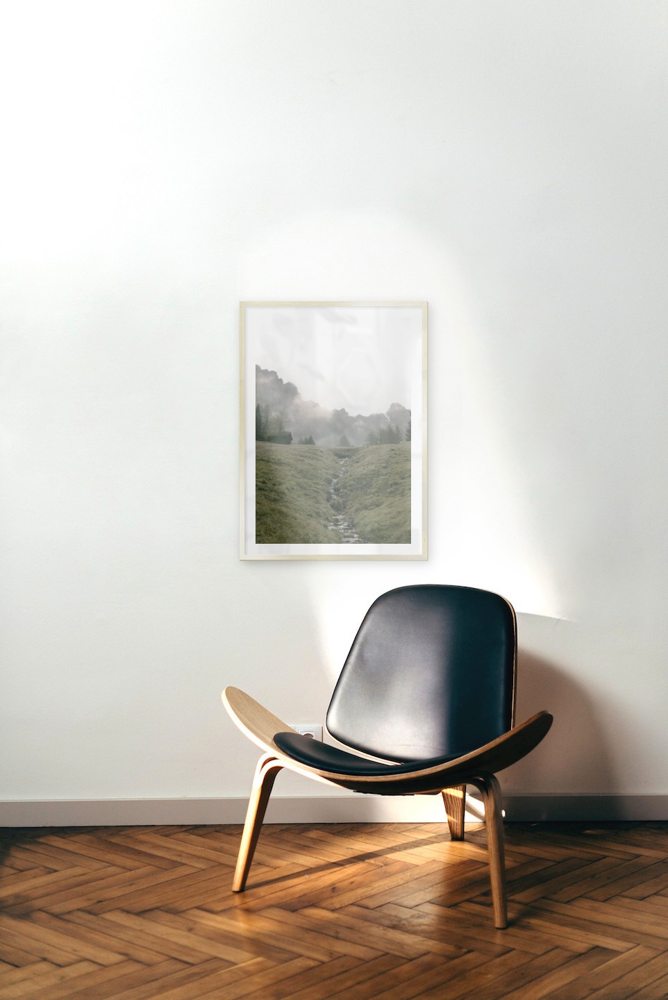 Gallery wall with picture frame in gold in size 50x70 with print "Green valley in front of mountains"