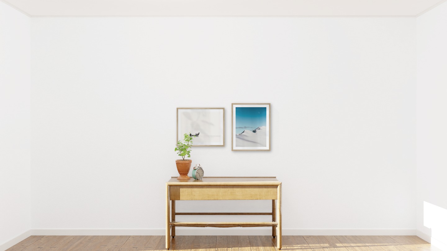 Gallery wall with picture frames in wood in sizes 40x50 with prints "People in boat" and "Snowy mountain peaks"