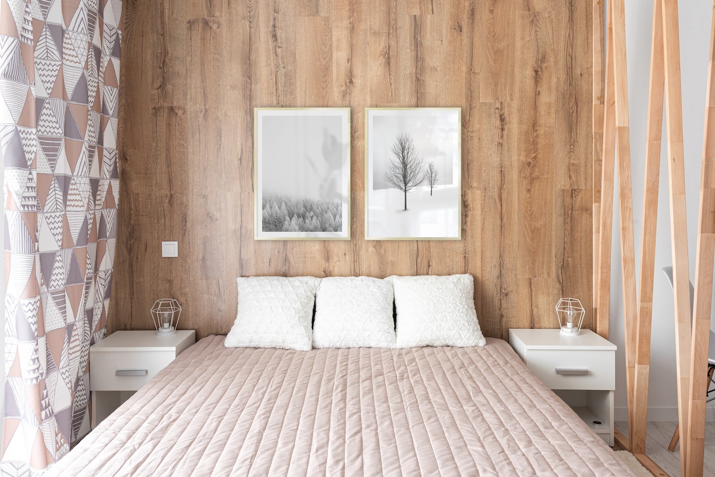 Gallery wall with picture frames in gold in sizes 50x70 with prints "Wooden tops in winter" and "Trees in the snow"